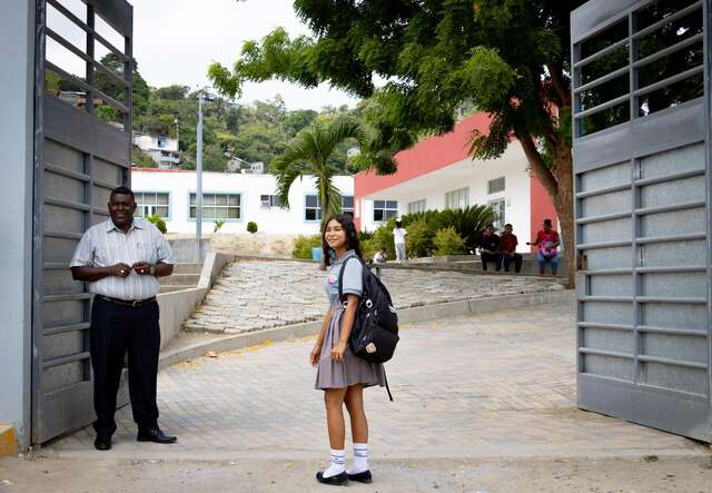 Yari walks into school with a smile