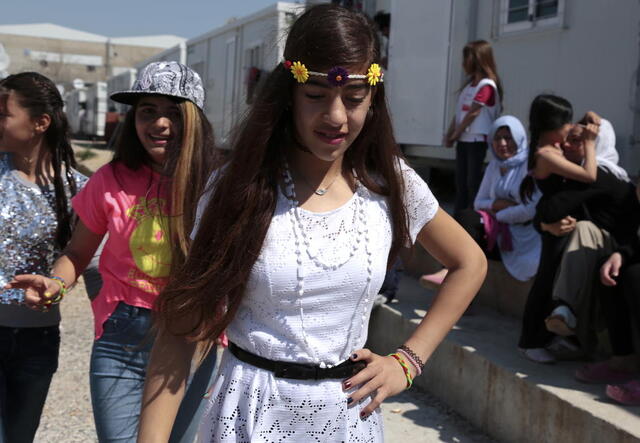 Nazia and Rolian dance at the Eleonas refugee camp near Athens, Greece