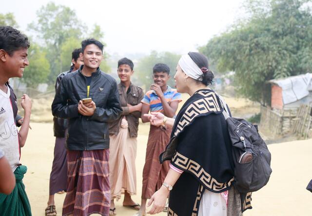 Razia Sultana speaks to men at a camp in Bangladesh