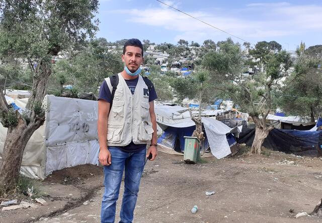 Shadi Mohammedali stands in Moria refugee camp in Lesvos, Greece