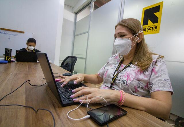 Two women working on laptops