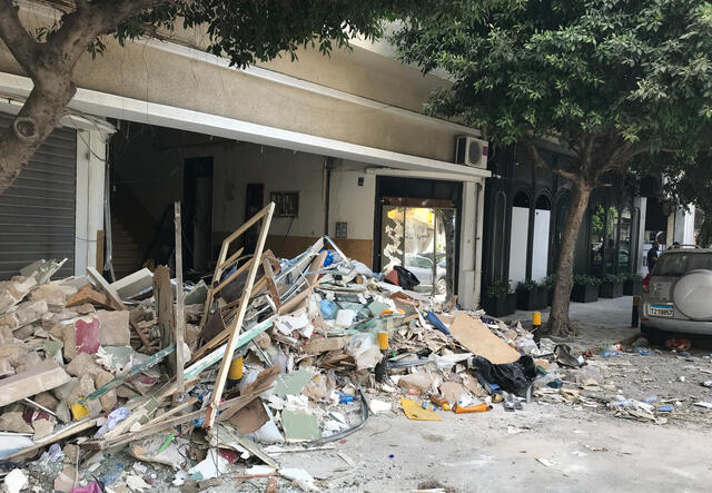 A damaged building covered in rubble in the aftermath of the Beirut blast.