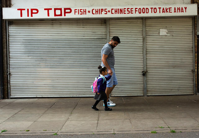 Maasom walking Nasrin to school.