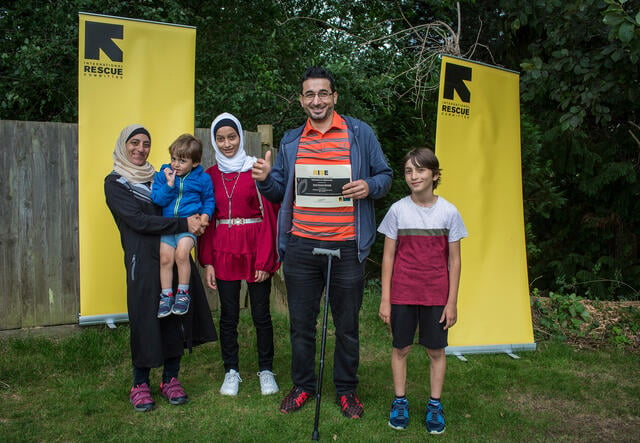 Khalil with his family at the IRC UK's graduation.