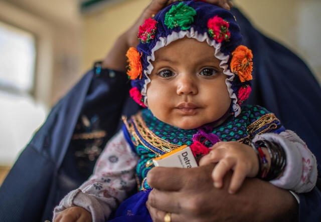 An Afghan mother brings her 5-month-old to a check up at an IRC-supported clinic. 