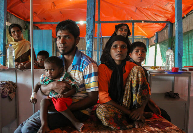 A Rohingya refugee family at an IRC-supported health Facility in Cox's Bazar, Bangladesh.