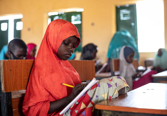 A girl takes notes in the IRC's classroom.