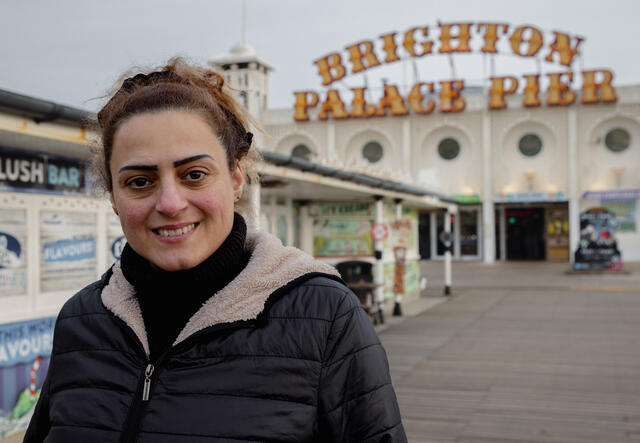 Chadia in front of Brighton pier.