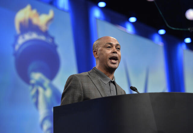 Tefere Gebre at the podium speaking at an AFL-CIO event