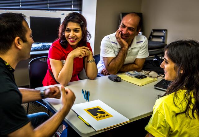 IRC staff help clients prepare resumes in Economic Empowerment.