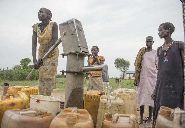 South Sudanese women pump water