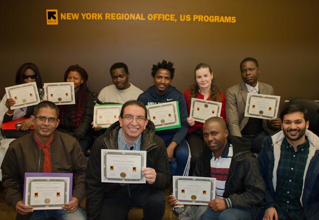 Participants holding their Microsoft office training certificates