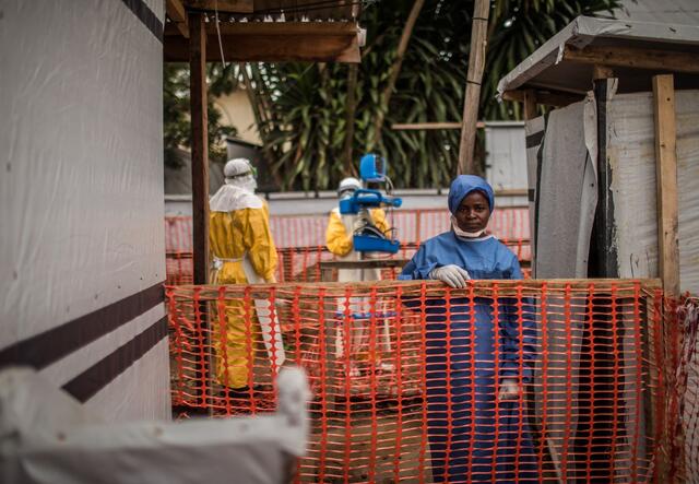 An Ebola survivor wears scrubs at an IRC-supported Ebola Treatment Center at Beni Hospital, in the Democratic Republic of Congo.