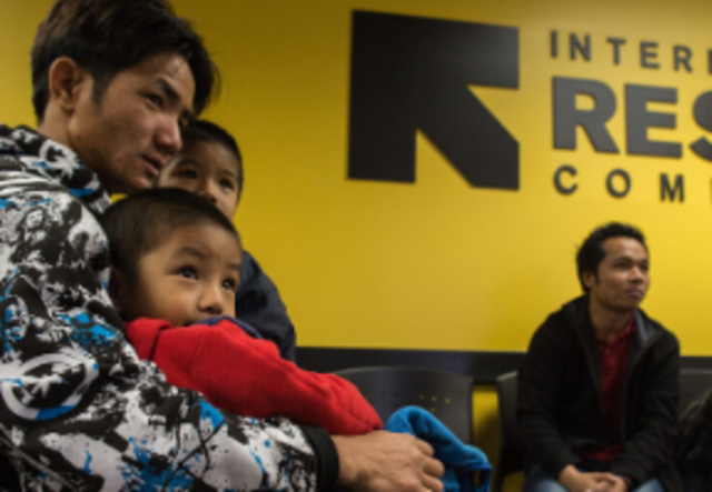 Family seated in IRC lobby.