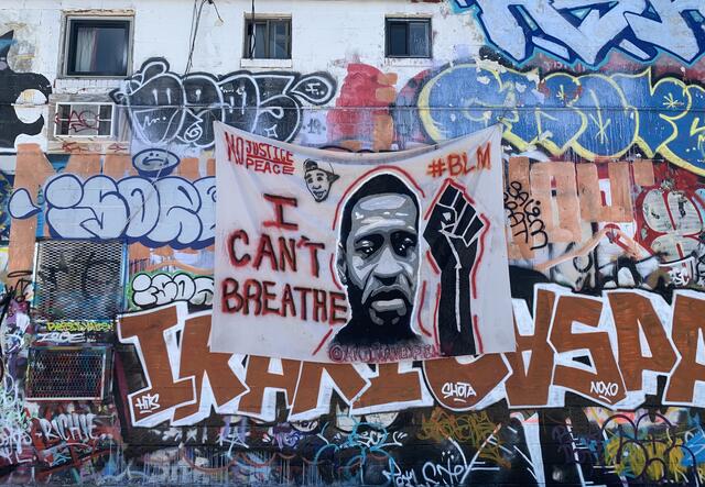 Banner of George Floyd displayed in "Graffiti Alley" opposite the IRC's Baltimore office.