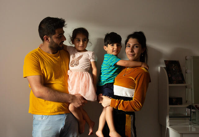 Syrian-Kurdish refugees Maasom and Hiba hold their children Nasrin and Omar.