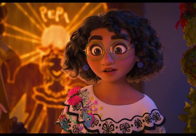 Mirabel from Encanto. She has curly hair and glasses. 