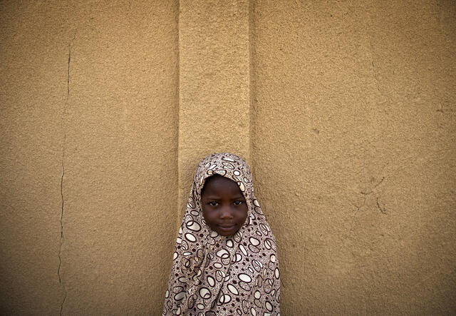 A Malian girl waits to see receive a free consultation at a medical clinic in Gao, Mali, run by the the Niger contingent of the UN Multidimensional Integrated Mission in Mali (MINUSMA).