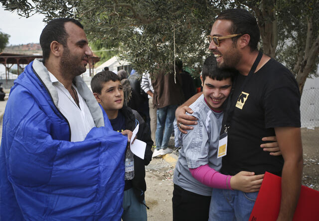 IRC information officer Ahmed Qader speaking to Syrian refugees from Homs at the Kara Tepe transit site on Lesbos.