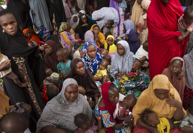 Women and children visit an IRC mobile medical team