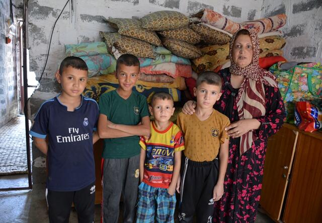 Displaced Iraqi mother with her four sons