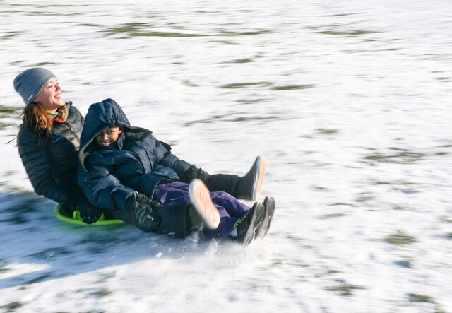 Family mentor Jamie Utz takes eight-year-old Muhammed sledding
