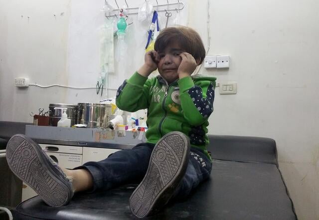 A Syrian child receives treatment at a hospital after chemical attack