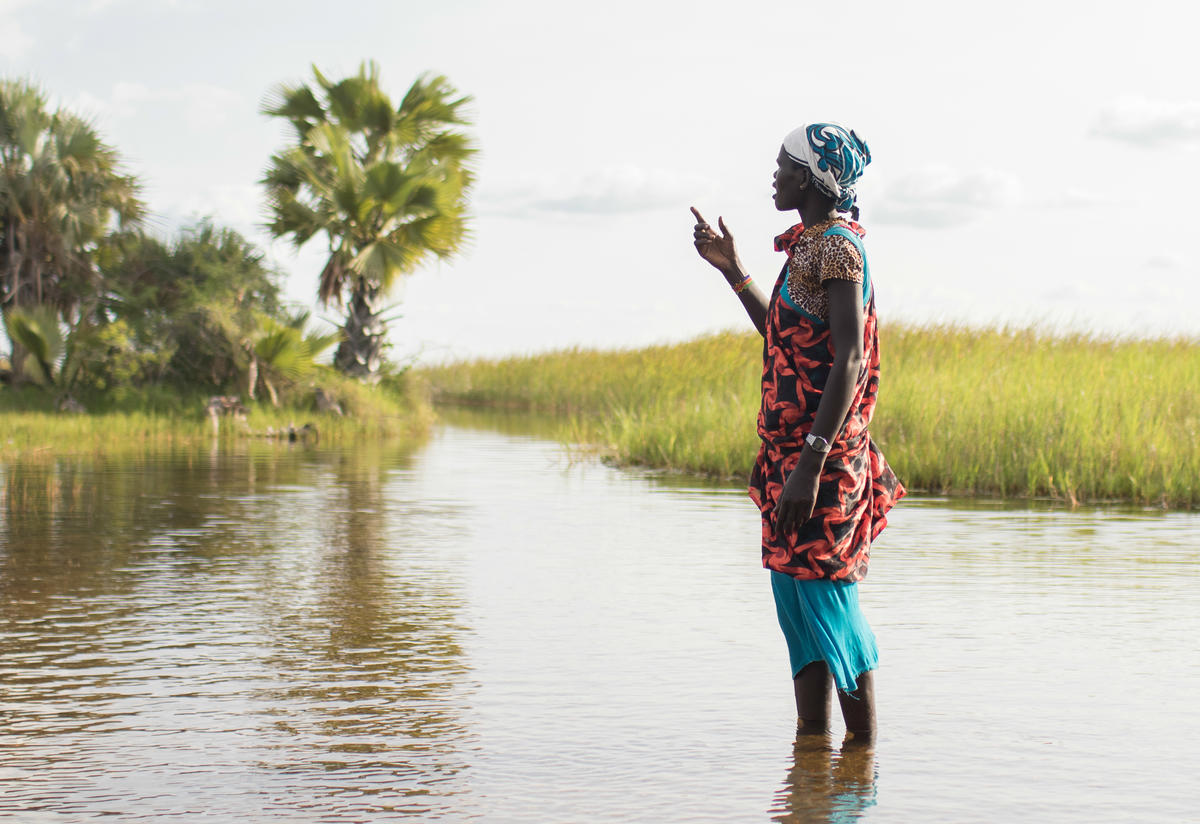 Many people displaced by fighting have fled to the swamps. A woman stands in a swamp in Unity State, South Sudan