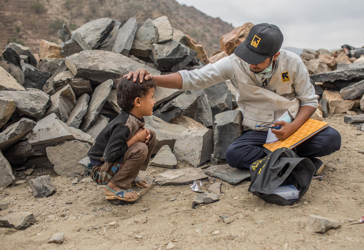 International Rescue Committee mobile health clinic provides integrated health, reproductive health and nutrition services to internally displaced persons and host community members living in the remote, mountain village of Okiba, Yemen. An IRC health worker examines a child in the mountain village of Okiba, Yemen