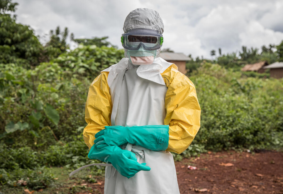 A health worker is dressed in full personal protective equipment to disinfect Case Du Salut health facility in Mabalako, North Kivu, Democratic Republic of Congo