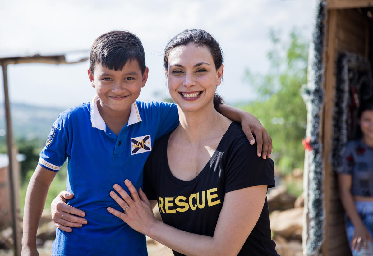 Morena Baccarin with a young Venezuelan refugee living with his family in the Colombian border city of Cúcuta.