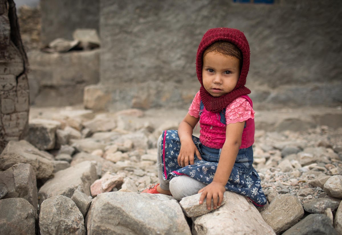 Even before the current crisis, Yemen’s malnutrition rate ranked as one of the world’s worst A young girl sits on the ground in a village in Yemen