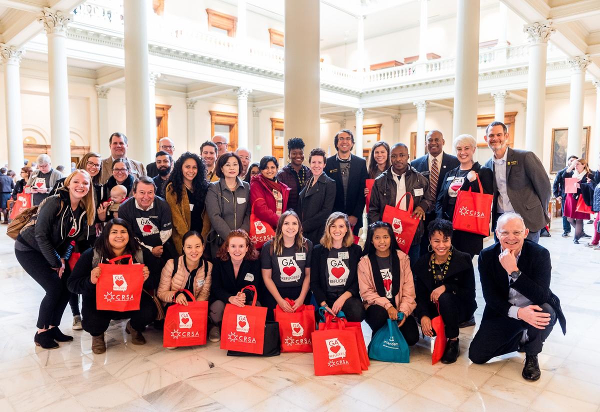 Team IRC Atlanta at the New Americans Celebration, including special guests, Hans Van de Weerd and Nuam San.