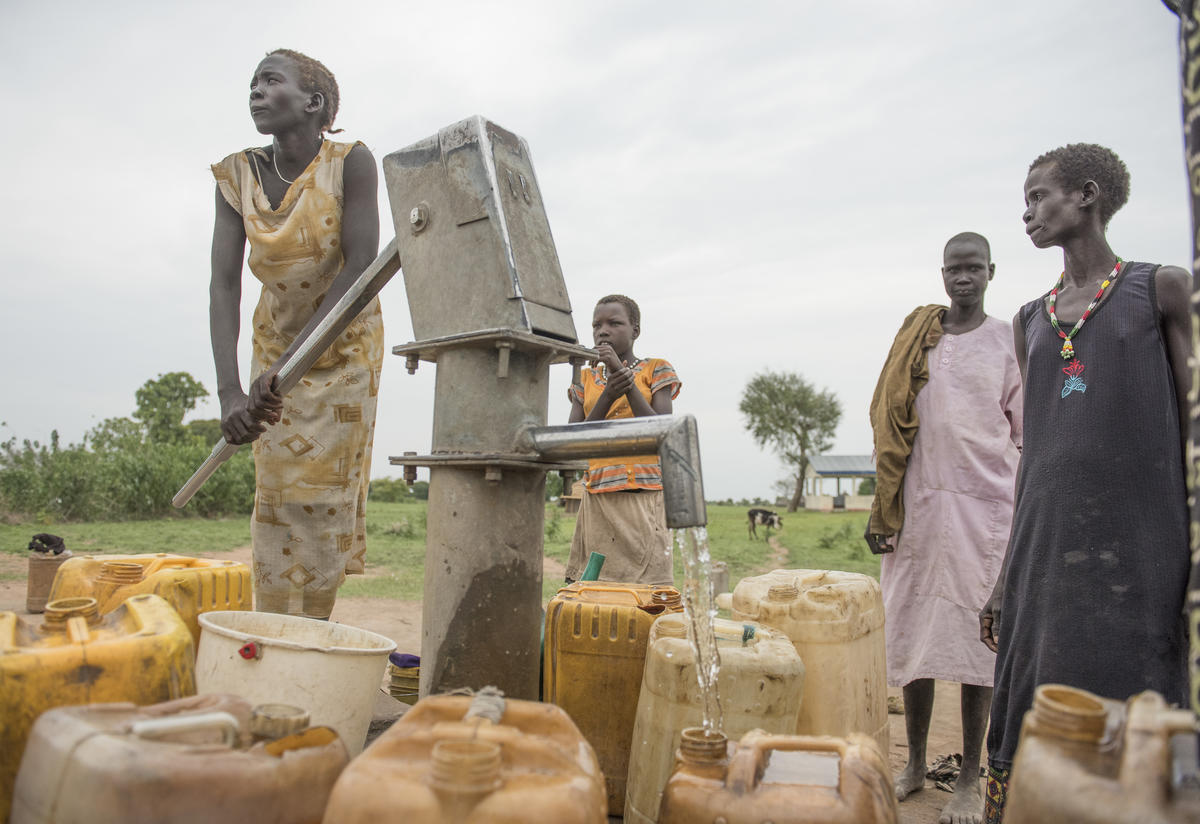 South Sudanese women pump water South Sudanese women pump water