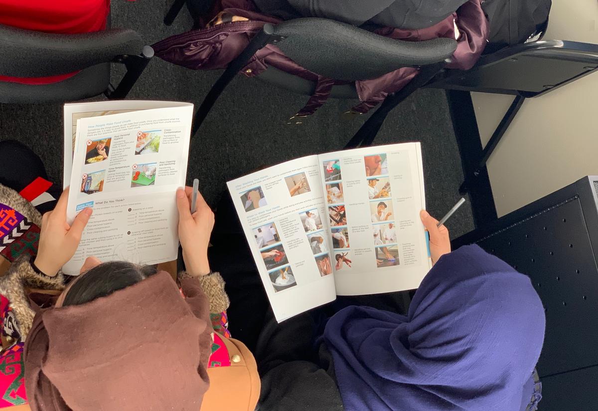 Participants learned essential food safety skills while sharing dishes from their home cuisines.