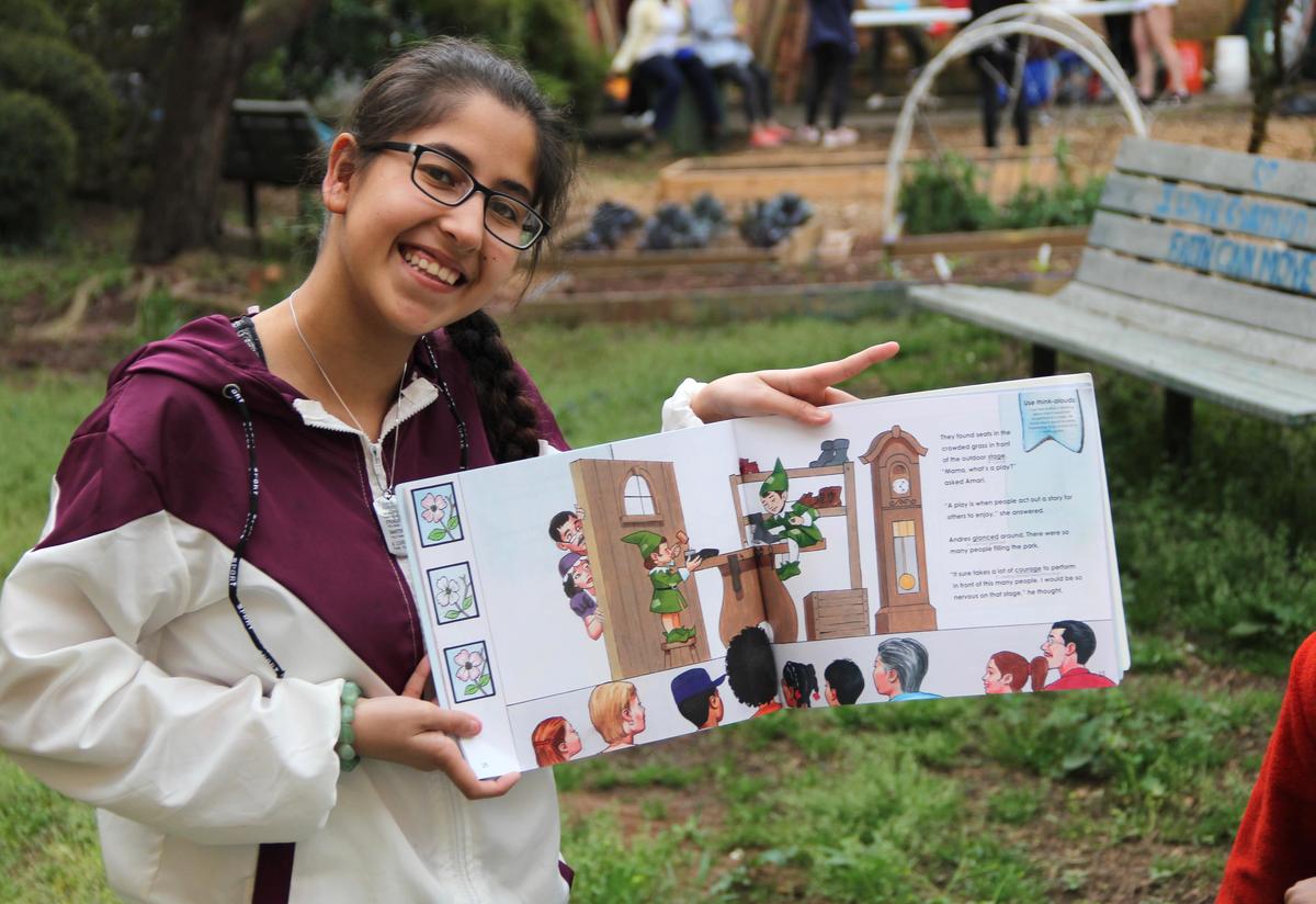 "Spreading happiness to the kids through reading them a book and spending fun time with them." –Ayat "Spreading happiness to the kids through reading them a book and spending fun time with them." –Ayat