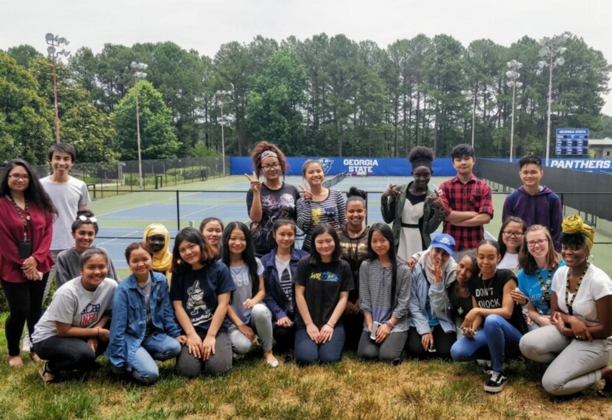 Georgia State University Perimeter College - Clarkston Campus served as a "home base" for this year's Ready, Set, College! summer camp. Summer camp students take a group picture in front of the GSU sign.