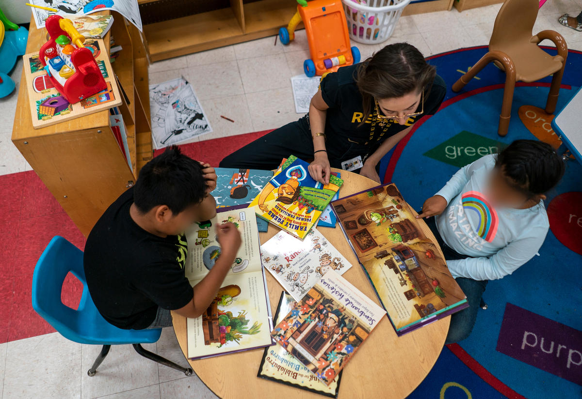 Asylum seeking children reading Asylum seeking children reading