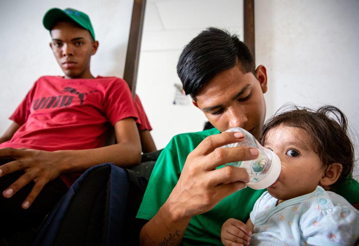 Baby Diana was named after the International Rescue Committee nurse who visited her Venezuelan mother during her pregnancy in Colombia. A baby is bottle-fed by her 15-year-old cousin, a Venezuelan refugee in Colombia. The family was supported by the IRC.