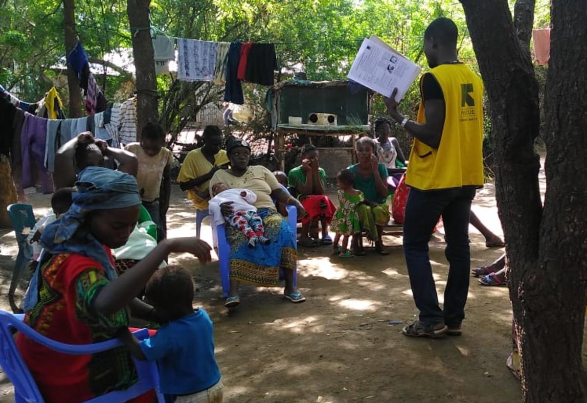 A Community Health Worker speaks to the community in Kakuma refugee camp in Kenya. 