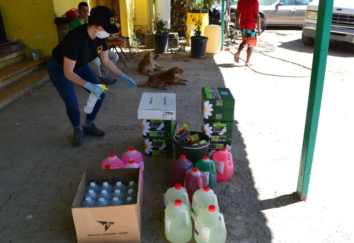 In Ciudad Juárez, IRC staff deliver cleaning supplies vital to combating COVID-19. An IRC staff member stands above buckets of cleaning supplies to be delivered to shelters in Ciudad Juárez, Mexico.