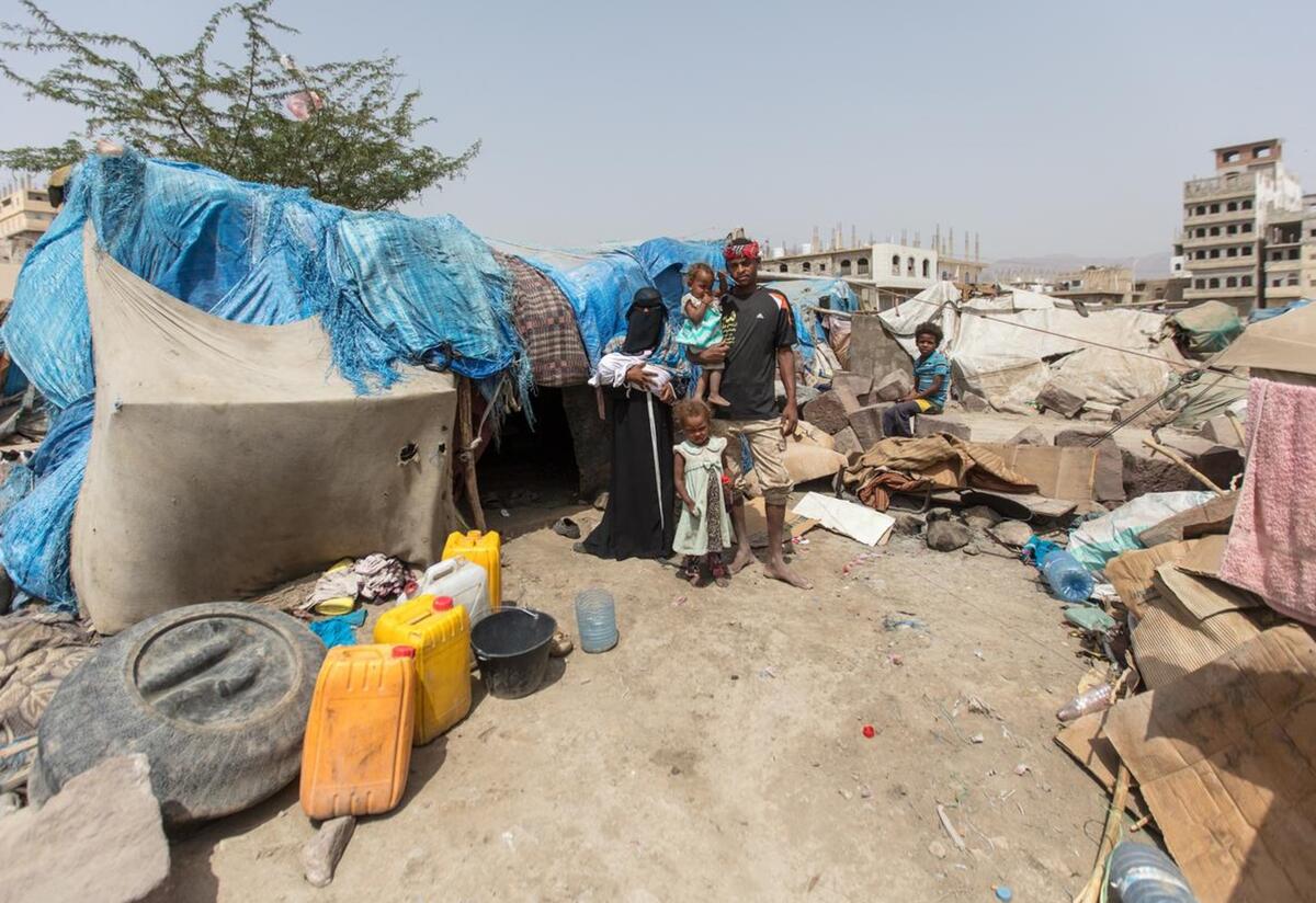 Bodor now lives with her family in a displacement camp in the Al Dhale'e region, after being driven from their homes by conflict. Bodor and her family stand together outside of the displacement camp where they live in the Al Dhale'e region in Yemen. They are standing in front of a makeshift tent.