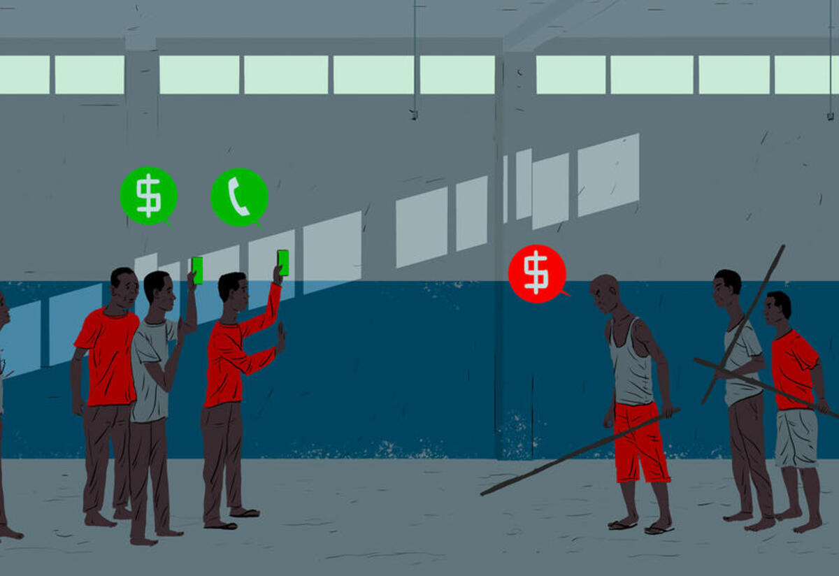 Men in detention in Libya Two groups of men stand in a detention center facing off from one another. A group of three are holding sticks and a speech bubble has a $. The other group are holding phones with speech bubbles with the dollar sign and phones.
