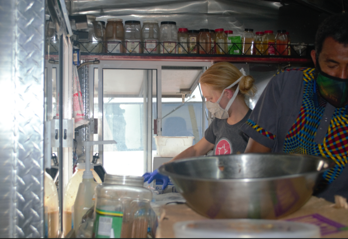 Abudu prepares a variety of dishes that reflect his home and travels. Abudu from Kafe Mamai cooking food.