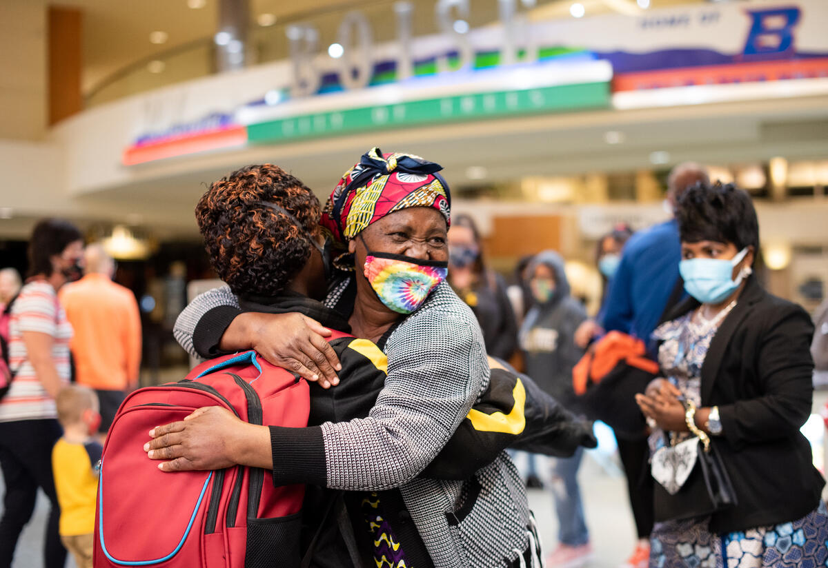 A family reunites after five years After Americans spoke up, President Biden agreed to lift a Trump-era limit on refugee admissions, reuniting families like Patrice, Wanyema and Mauwa’s. Two refugee women hug after being reunited in an airport.