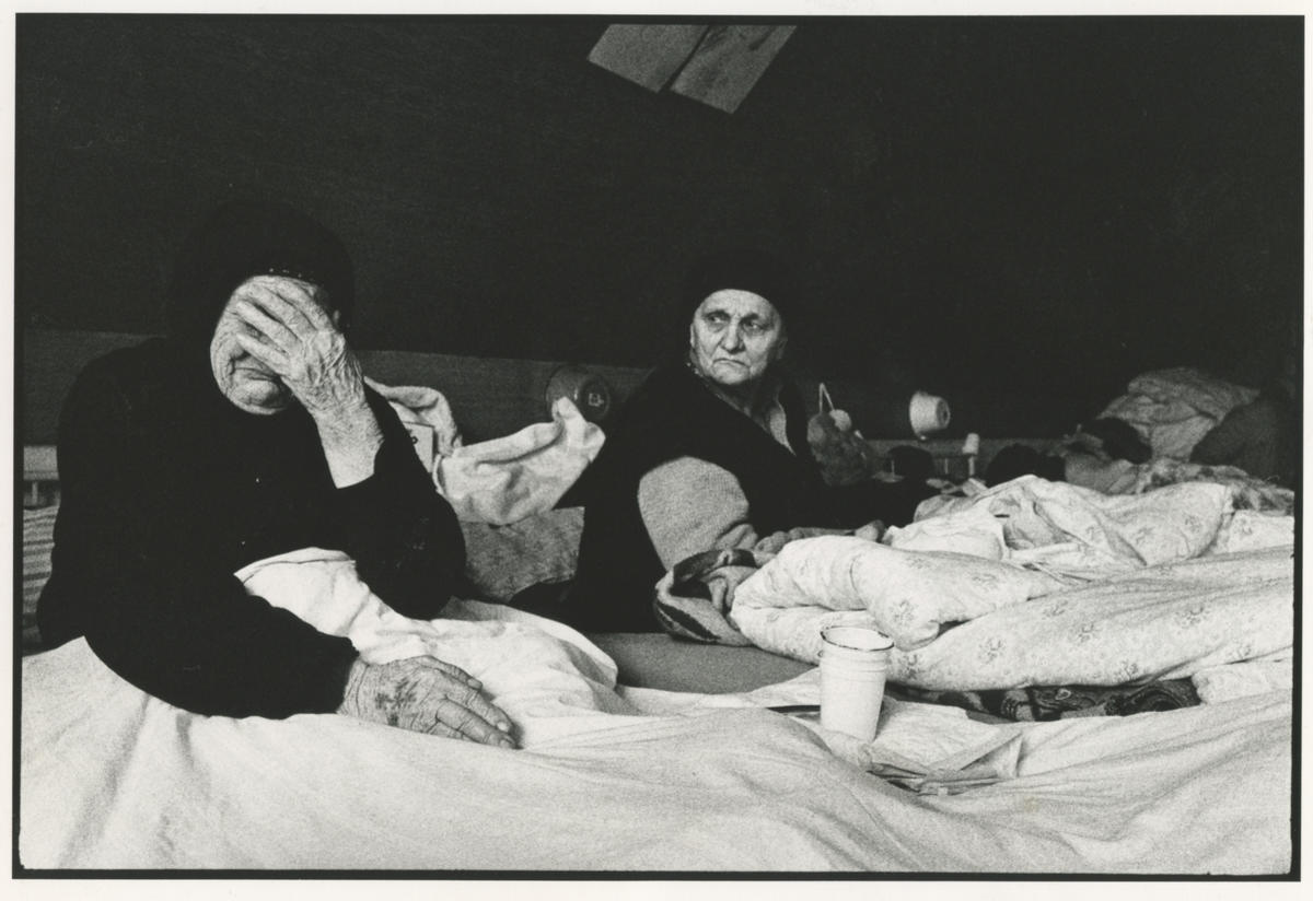 Bosnian refugees in Croatia Two Bosnian women lie in beds in a refugee camp in Croatia, one of whom is crying.