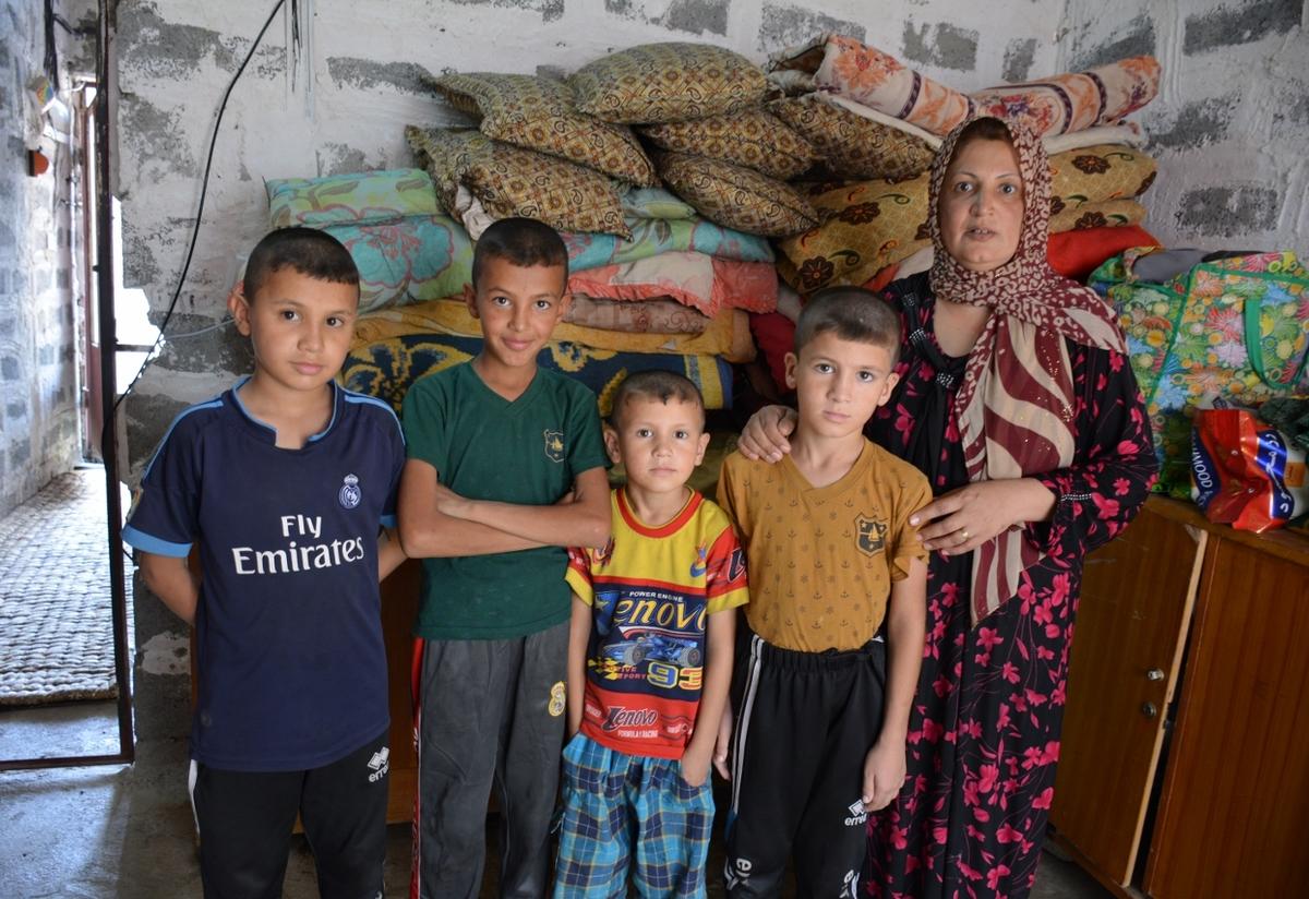 Displaced Iraqi mother with her four sons Displaced Iraqi mother with her four sons