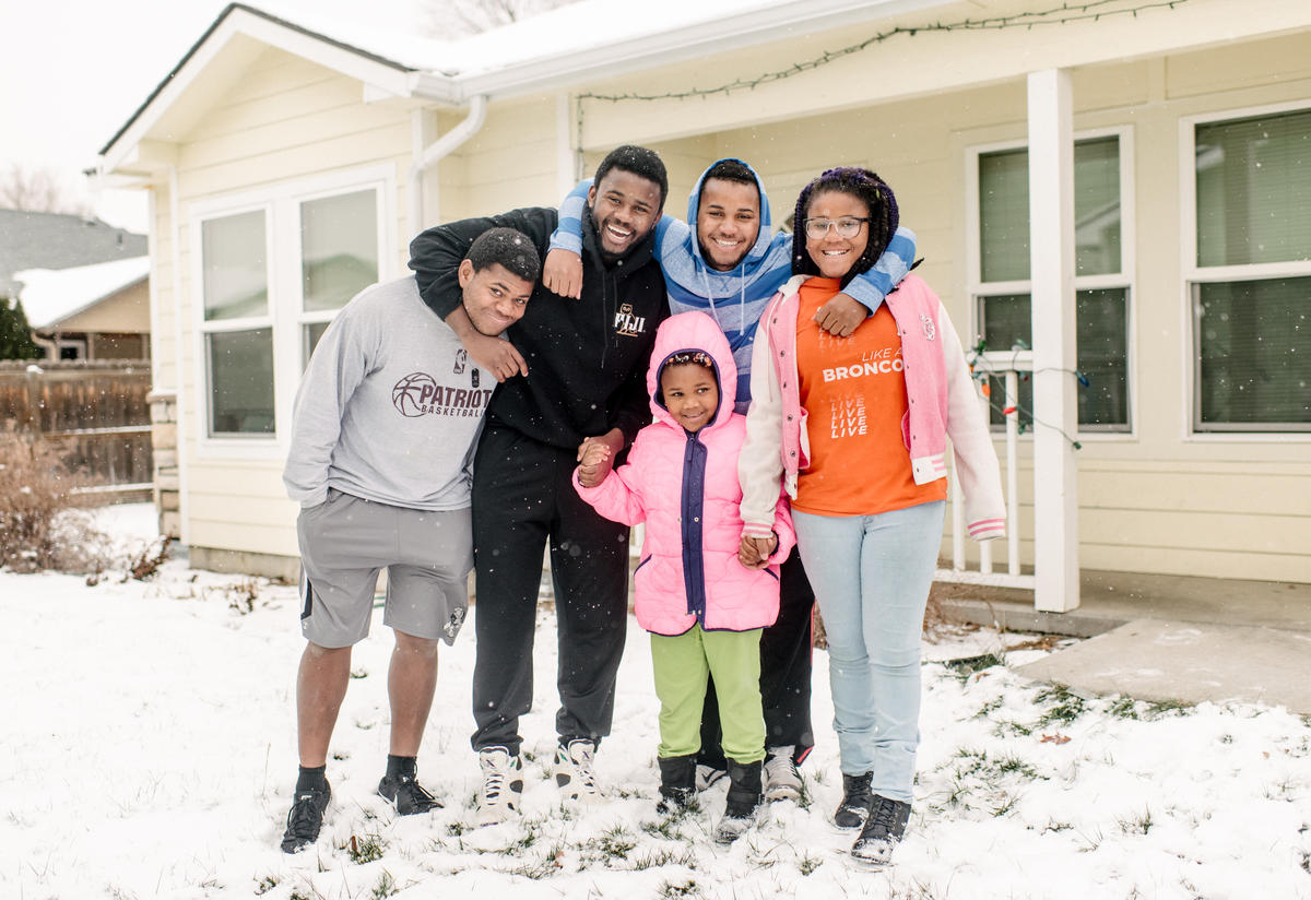 The Ngalamulume siblings pose for a photo in the snow in the front yard of their home in Boise.