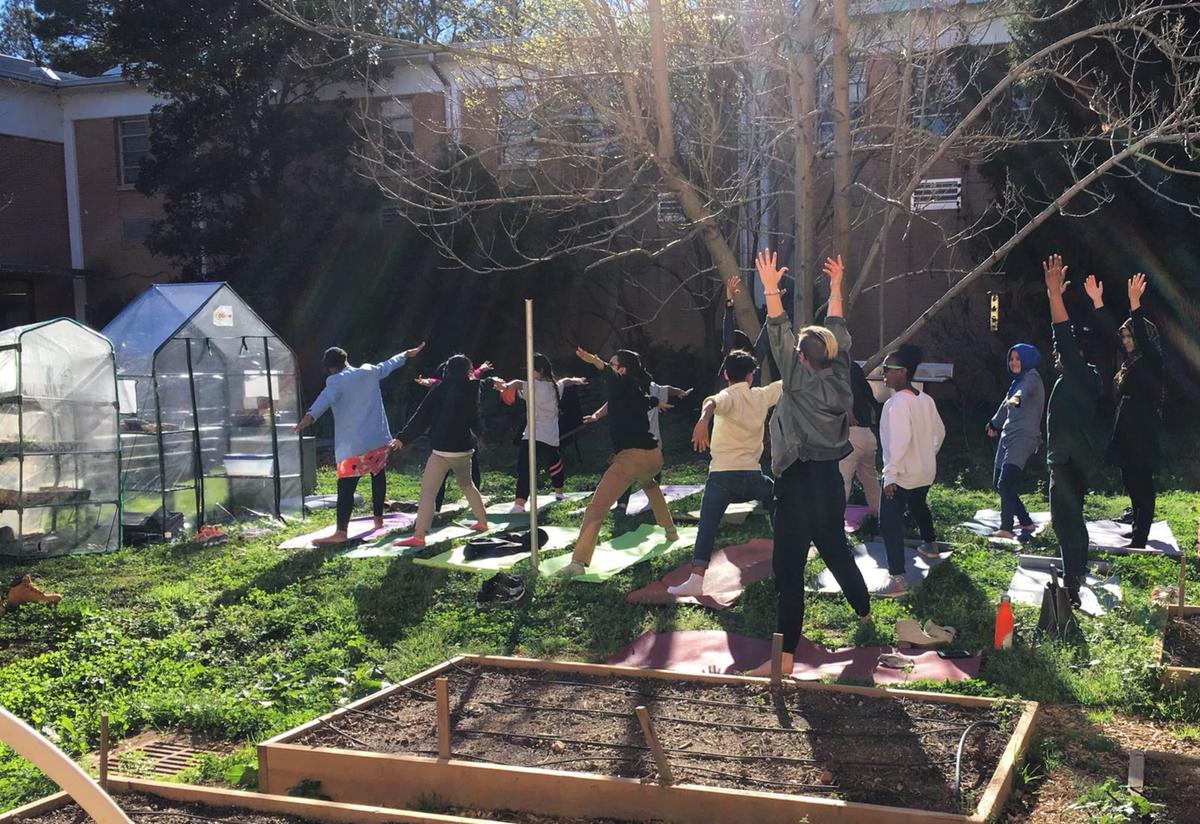 Enjoying yoga class in the Clarkston High School garden. Enjoying yoga class in the Clarkston High School garden.