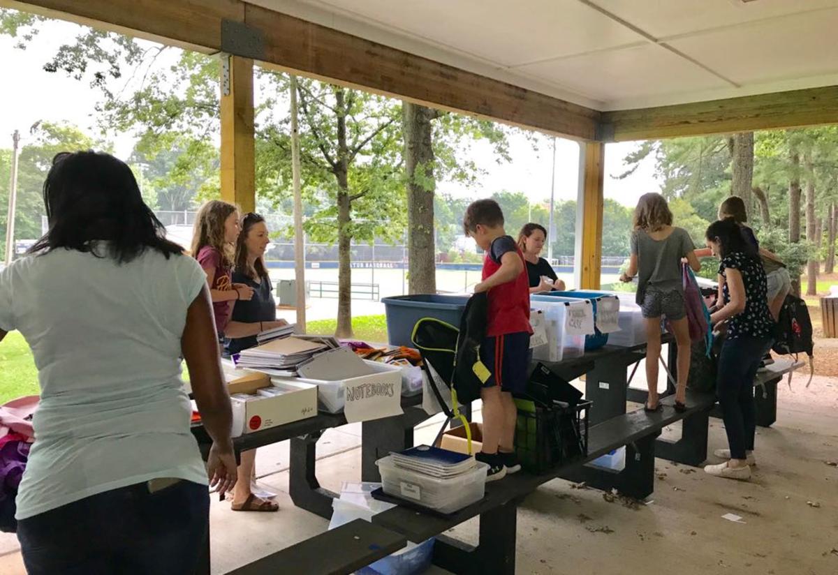 Atlanta community members assemble backpacks full of school supplies for refugee students. Atlanta community members assemble backpacks full of school supplies for refugee students.